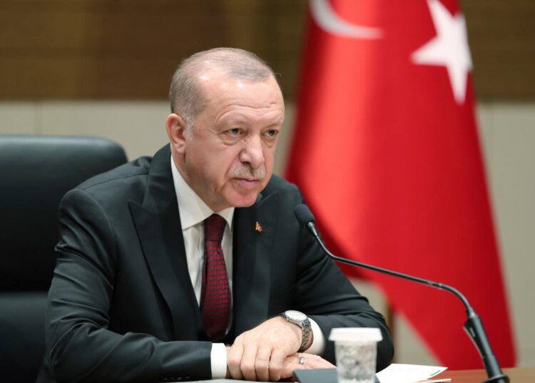 Turkish President Recep Tayyip Erdogan speaks to reporters before departing for a visit to Ukraine, in Istanbul, Monday, Feb. 3, 2020. Turkey hit targets in northern Syria, responding to shelling by Syrian government forces that killed at least four Turkish soldiers, the Turkish president said Monday. A Syrian war monitor said six Syrian troops were also killed.(Presidential Press Service via AP, Pool)