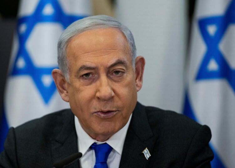 FILE - Israeli Prime Minister Benjamin Netanyahu chairs a cabinet meeting at the Kirya military base, which houses the Israeli Ministry of Defence, in Tel Aviv, Israel, Sunday, Dec . 24, 2023. Israel’s Supreme Court on Monday, Jan. 1, 2024, struck down a key component of Netanyahu’s contentious judicial overhaul, a decision that threatens to reopen the fissures in Israeli society that preceded the country’s ongoing war against Hamas.(AP Photo/Ohad Zwigenberg, Pool, File)